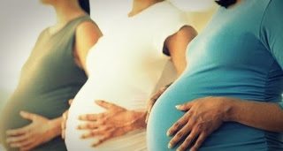 three pregnant women