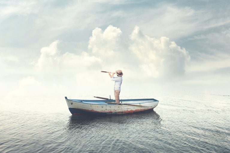 man standing in a boat