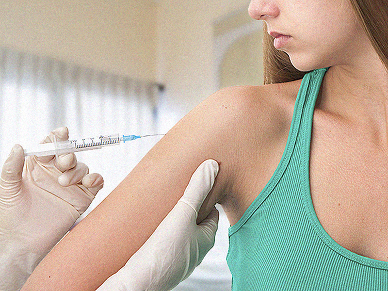 young girl receives Gardasil injection