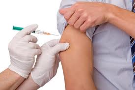 vaccine to boy's arm