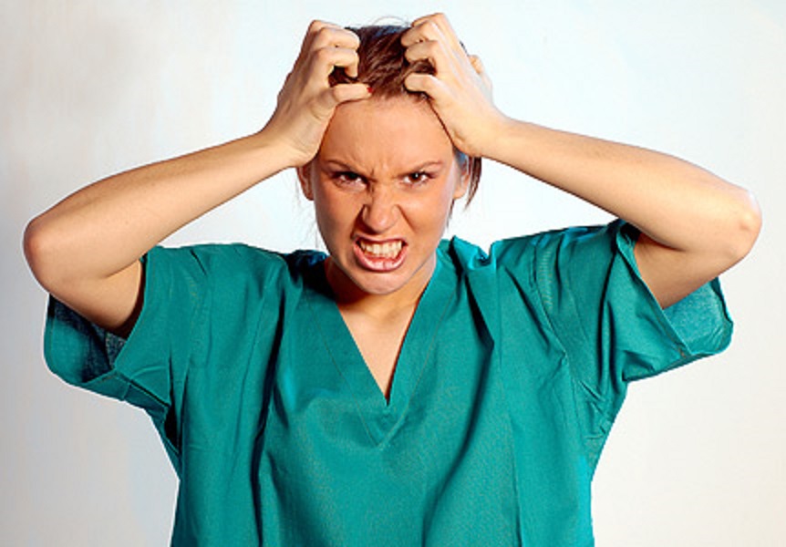 a nurse pulling her hair out