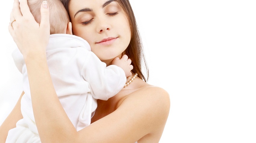 mother holding baby