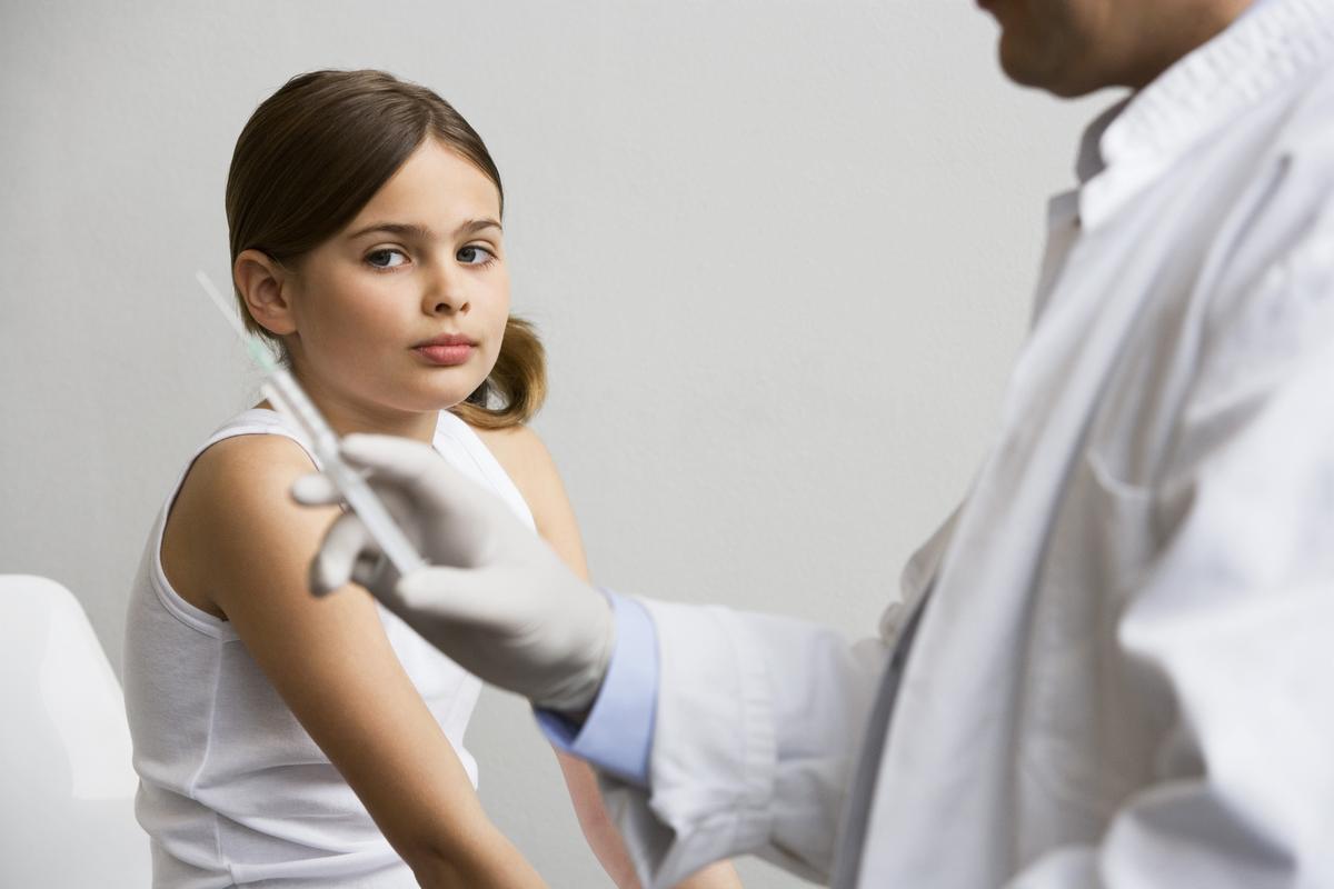 Girl waiting for Gardasil shot