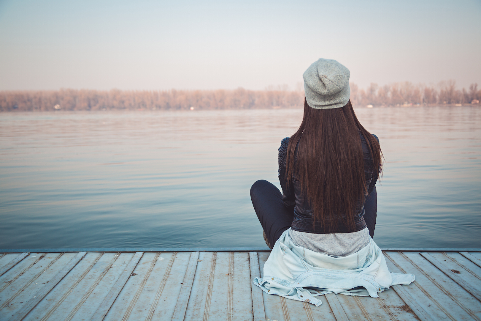woman gazing at a lake