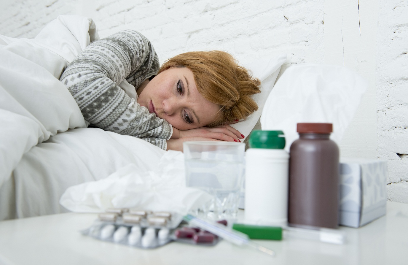 woman sick in bed