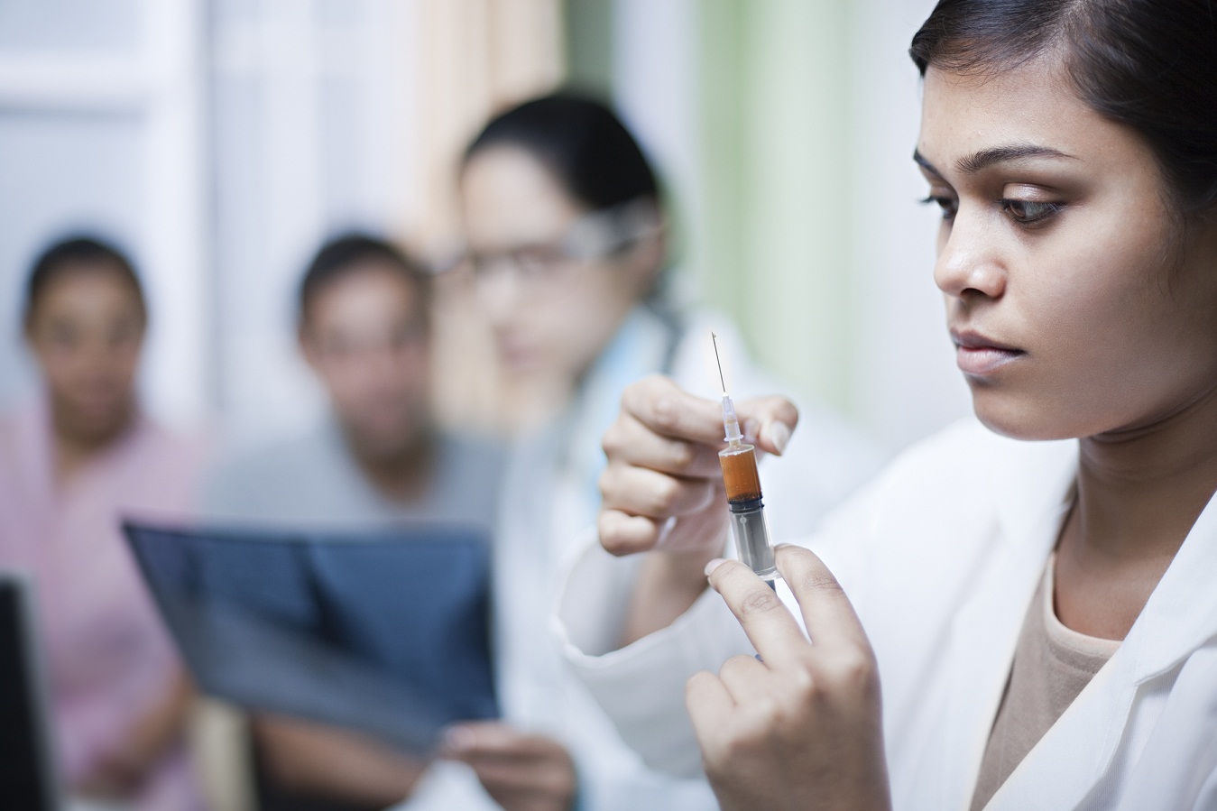 Indian doctor preparing an injection