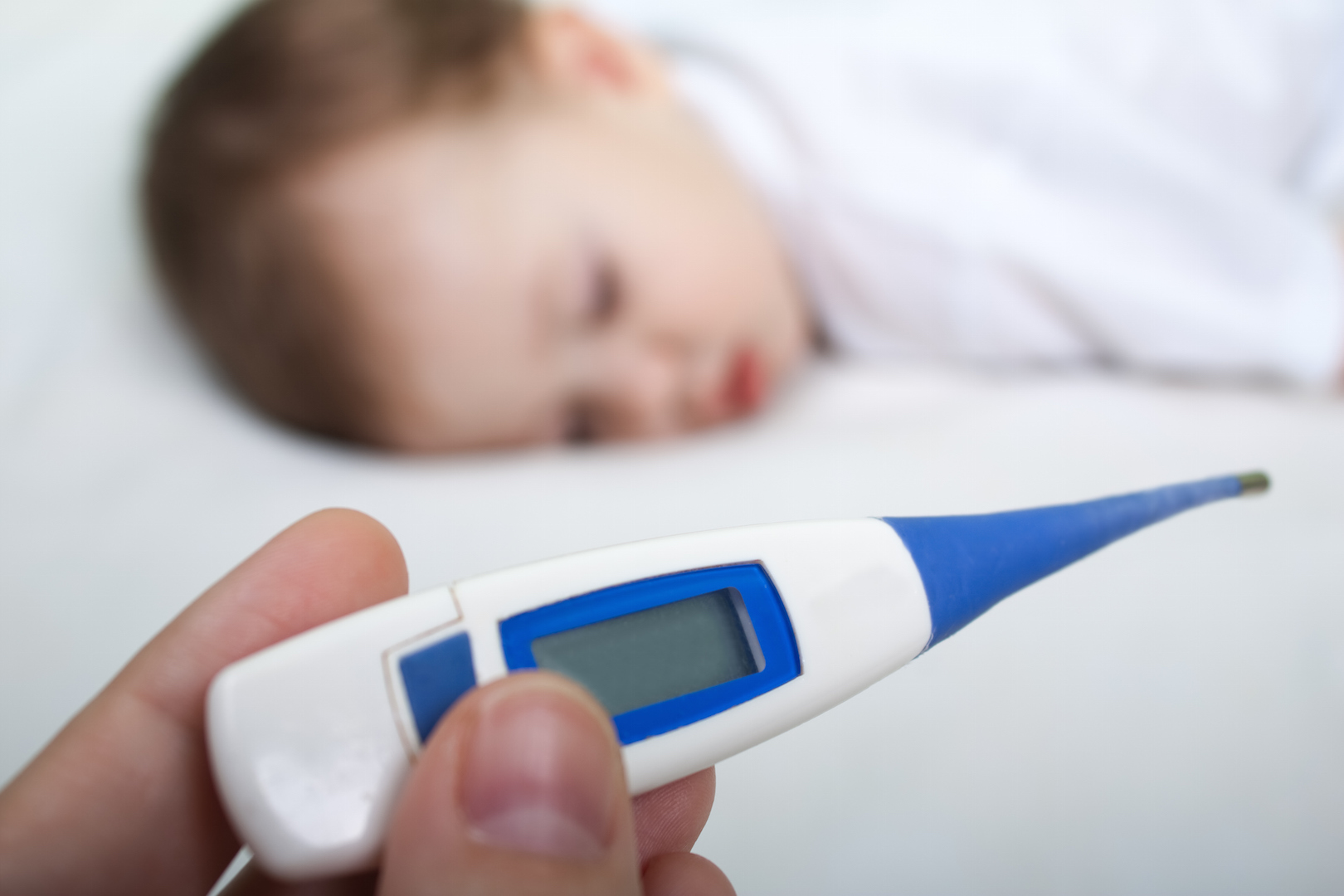 baby sleeping and thermometer