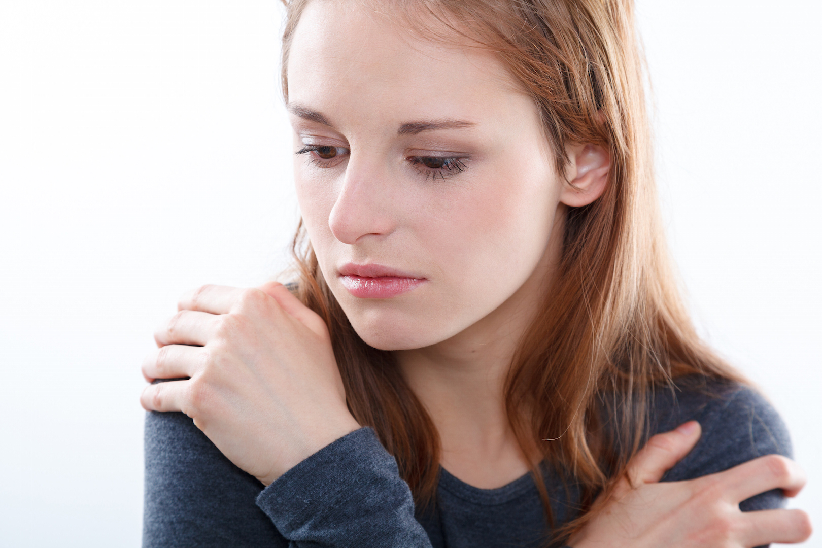 young woman with hands on shoulders