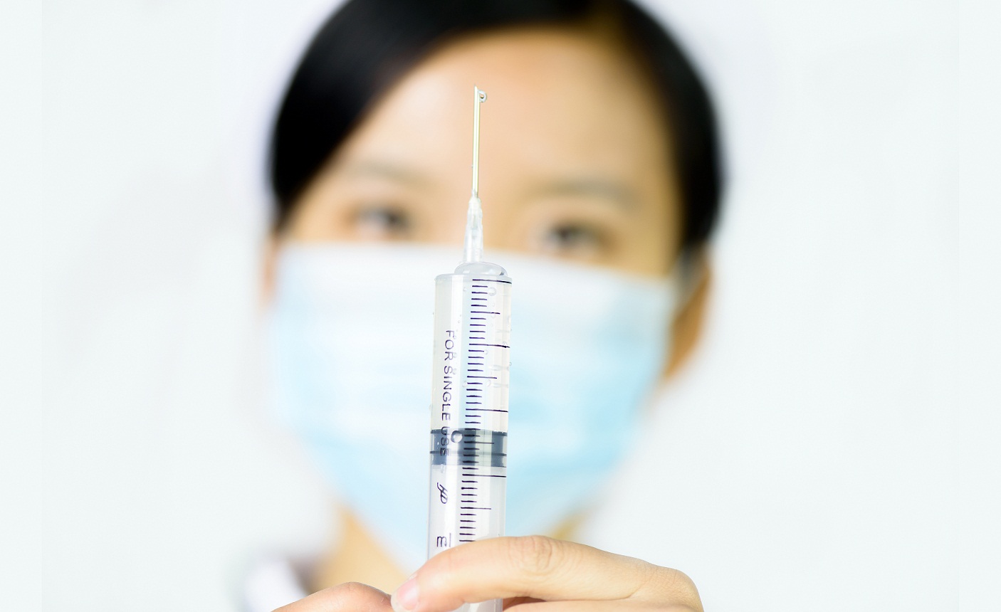 Chinese nurse with a vaccine