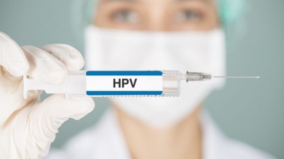 nurse holding up HPV vaccine Investigation Questions Gardasil Clinical Trial Safety Data