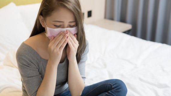 girl with mask Whooping Cough Outbreaks Continue Nationwide Due to Failed Pertussis Vaccine