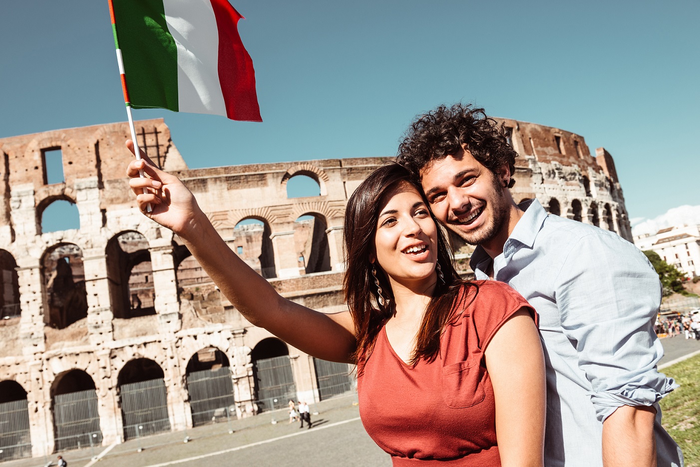 Italian couple waving flag