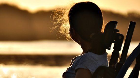 girl in a wheelchair ‘Modern Polio’ Cases Confirmed in 16 States