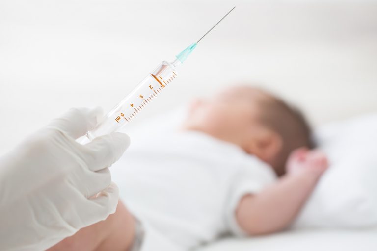 vaccine syringe and infant