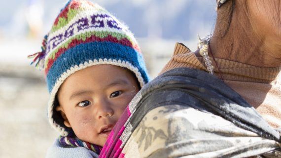 Nepalese baby carried by mother Infant in Nepal Dies Hours After Getting DPT Vaccine