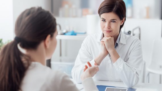 doctor listening to her patient Listening vs Coercion on ‘Vaccine Hesitancy’
