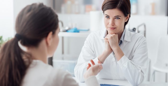 doctor listening to her patient Listening vs Coercion on ‘Vaccine Hesitancy’