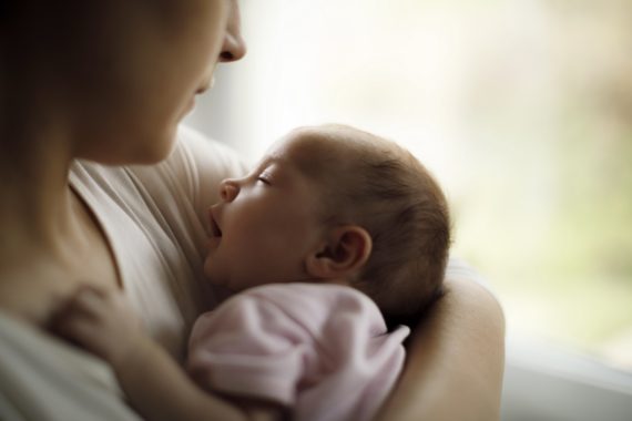 mother holding baby A Baby Died After Vaccination