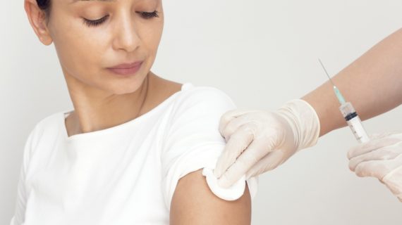 woman in white gets vaccinated Kentucky Investigating Multiple Infections Following Vaccinations