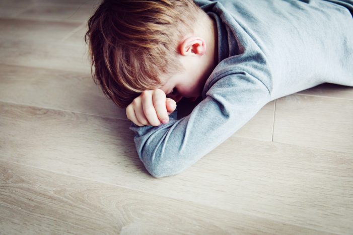 boy on floor Autism Affecting Up to 1 in 36 Children in America