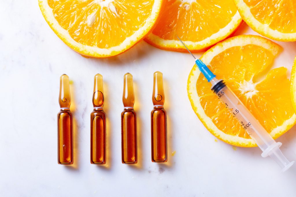 orange slices and syringe