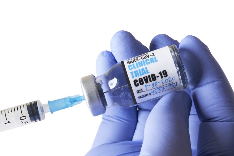 COVID vaccine and rubber glove