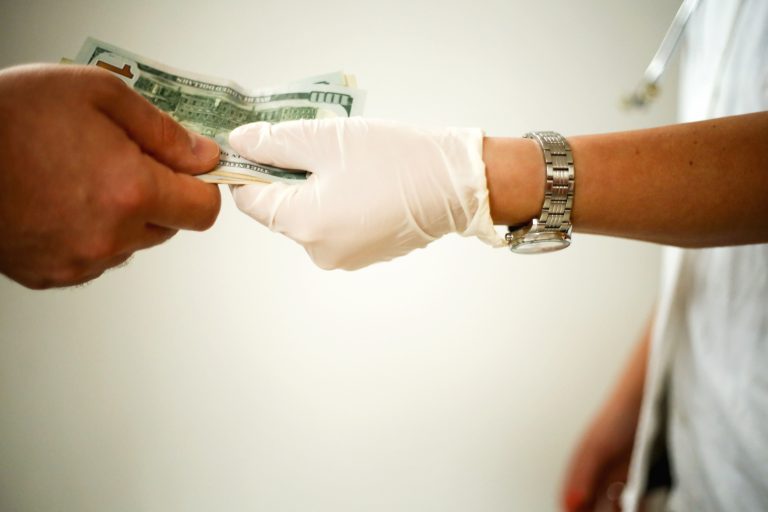 doctor receiving cash