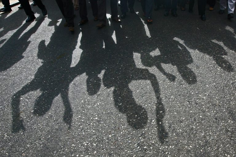 shadow of protesters