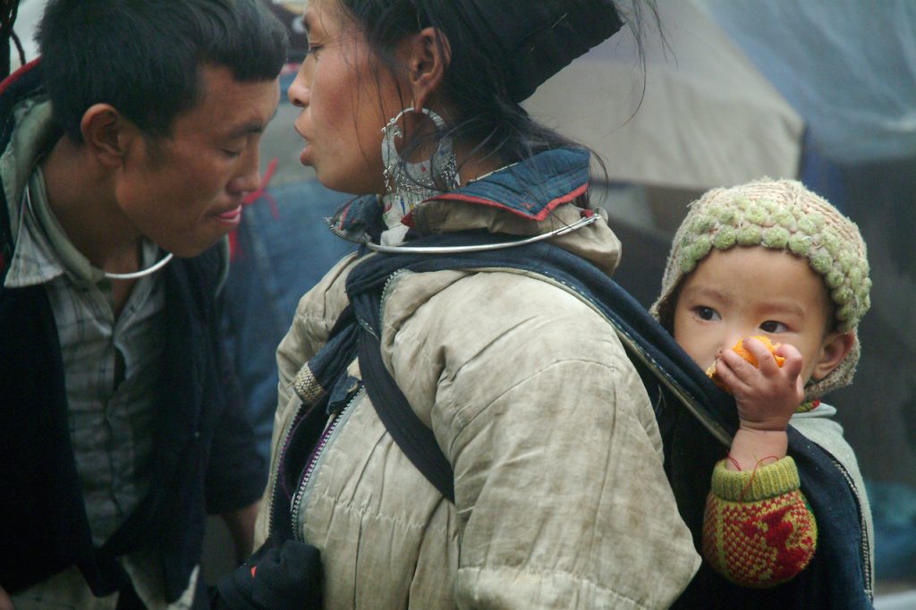 Vietnamese woman carrying baby