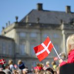 girl holding Danish flag