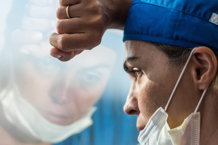 tired health care worker Many Health Care Workers Concerned About Safety of COVID-19 Vaccines