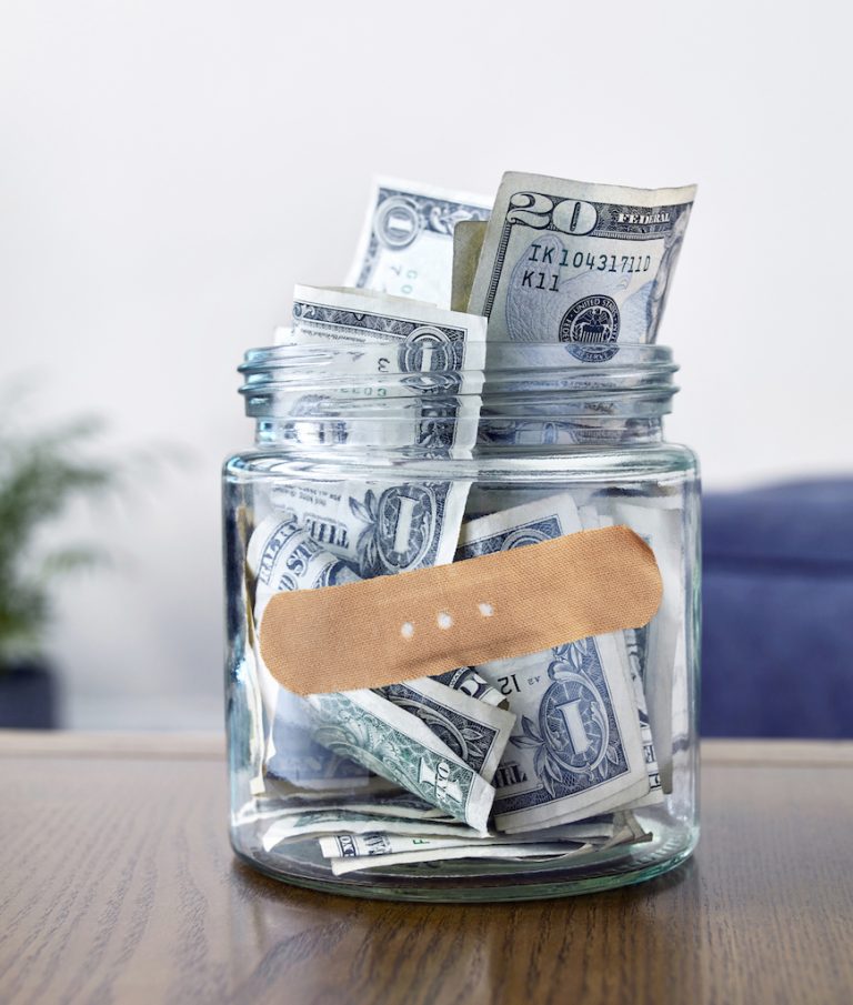 jar of cash with a band-aid