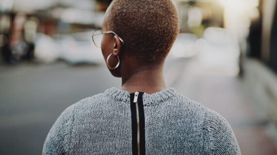 African-American woman wearing earring Minority Populations Targeted for Early COVID-19 Vaccination