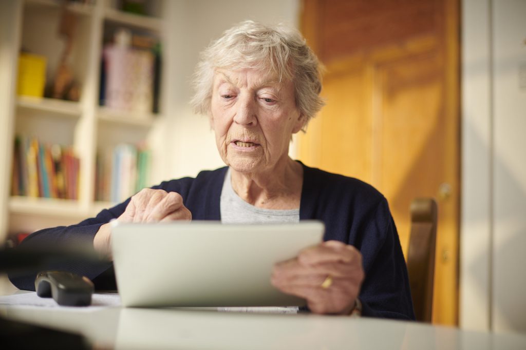 elderly woman with iPad