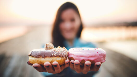 offering two doughnuts Businesses Offer Free Junk Food for Proof of COVID Vaccination