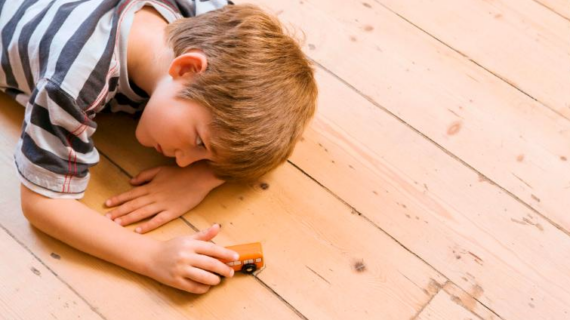 boy playing on wooden floor Autism Prevalence Rates in U.S. and Northern Ireland Continue to Rise