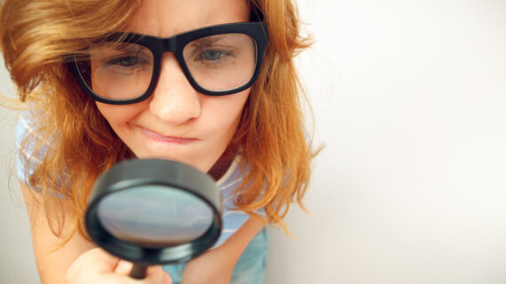 girl looking through looking glass Is it Really a Pandemic of the Unvaccinated?