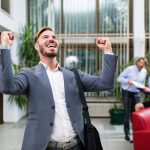 man pumping his fists