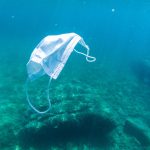 facemask drifting in the ocean