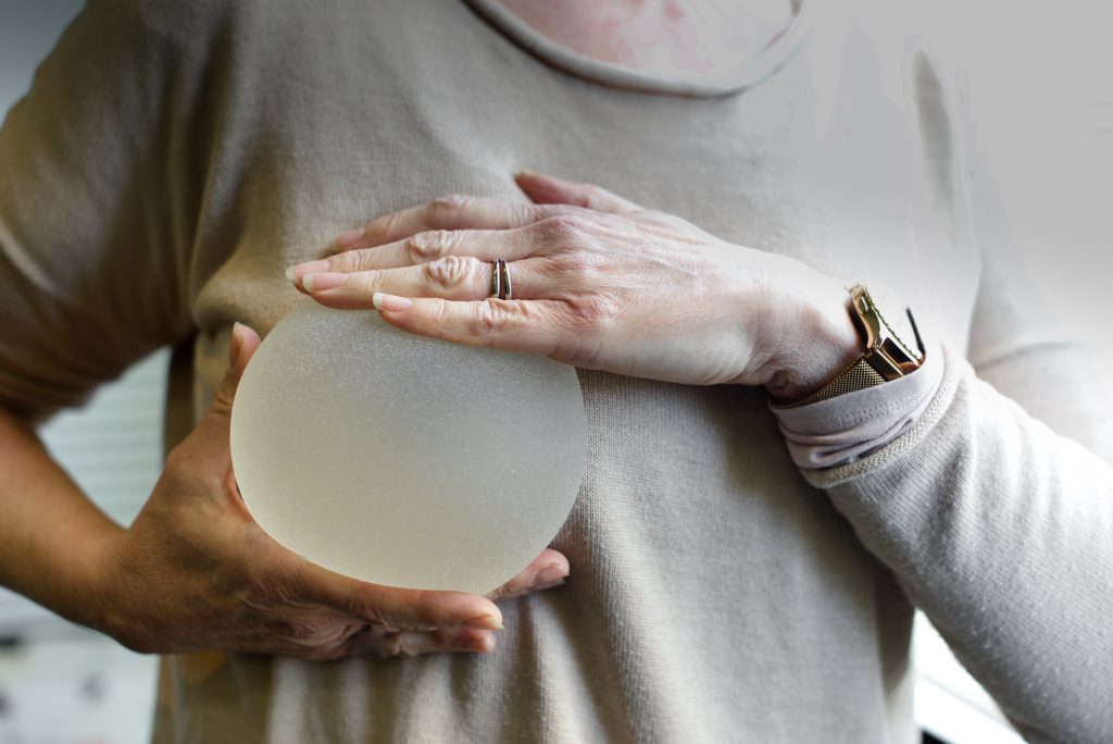 holding a breast implant
