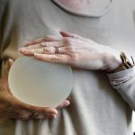 holding a breast implant