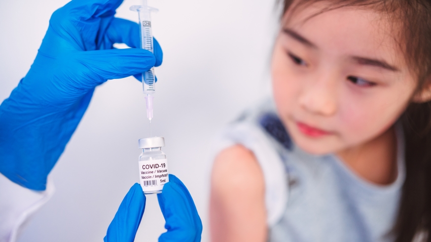 Asian girl gets vaccinated