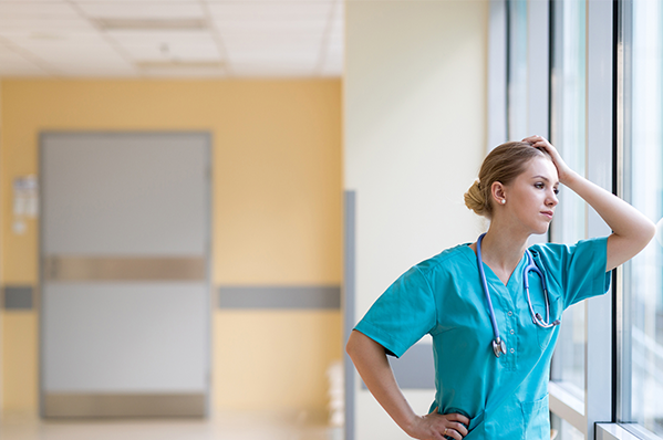 health care worker gazing out