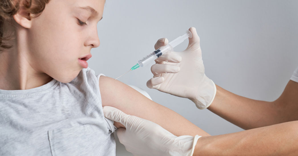 vaccinating a young girl