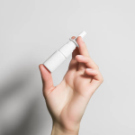 holding a FluMist bottle